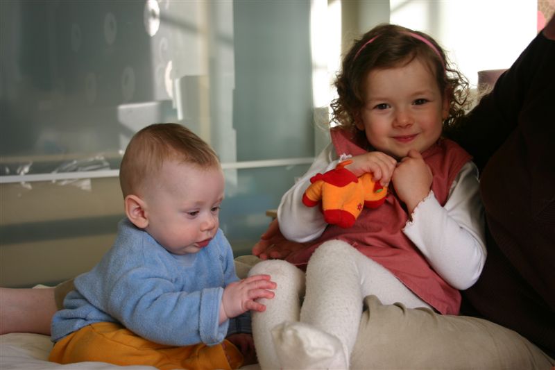 Anna, Nate sitting up on bed