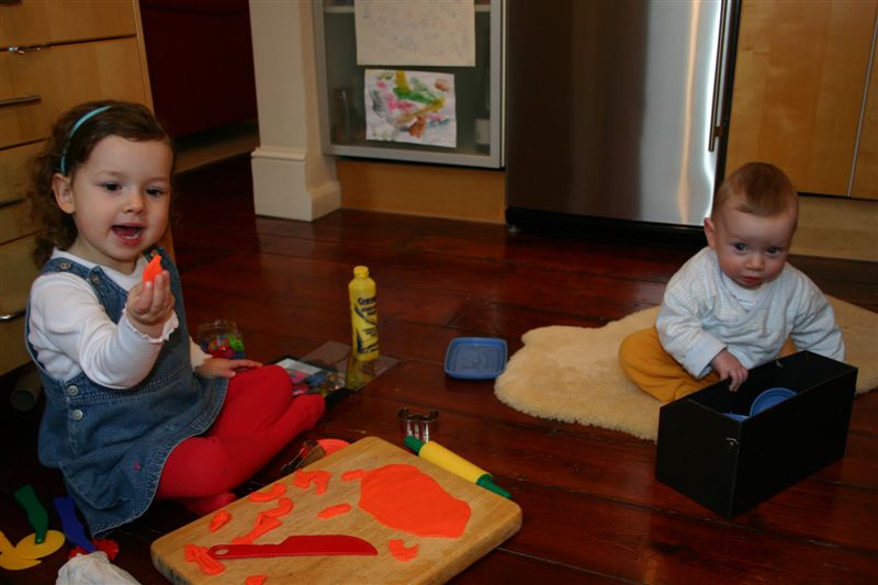 Anna and Nate playing on kitchen floor