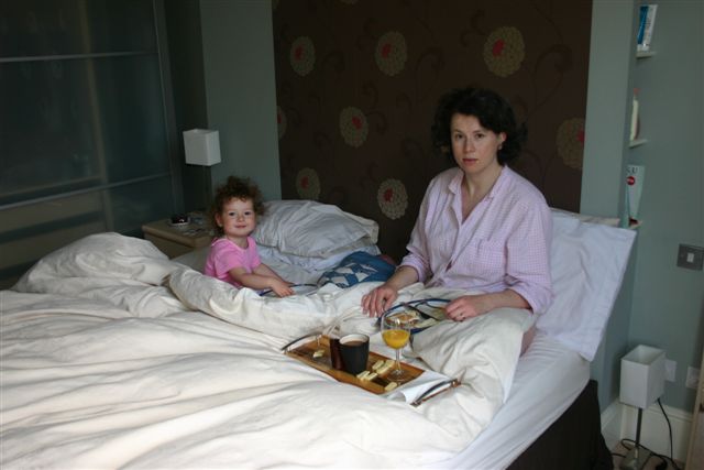 Family having breakfast in bed