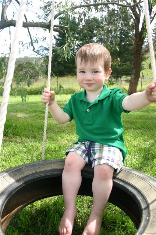 Alex on tire swing